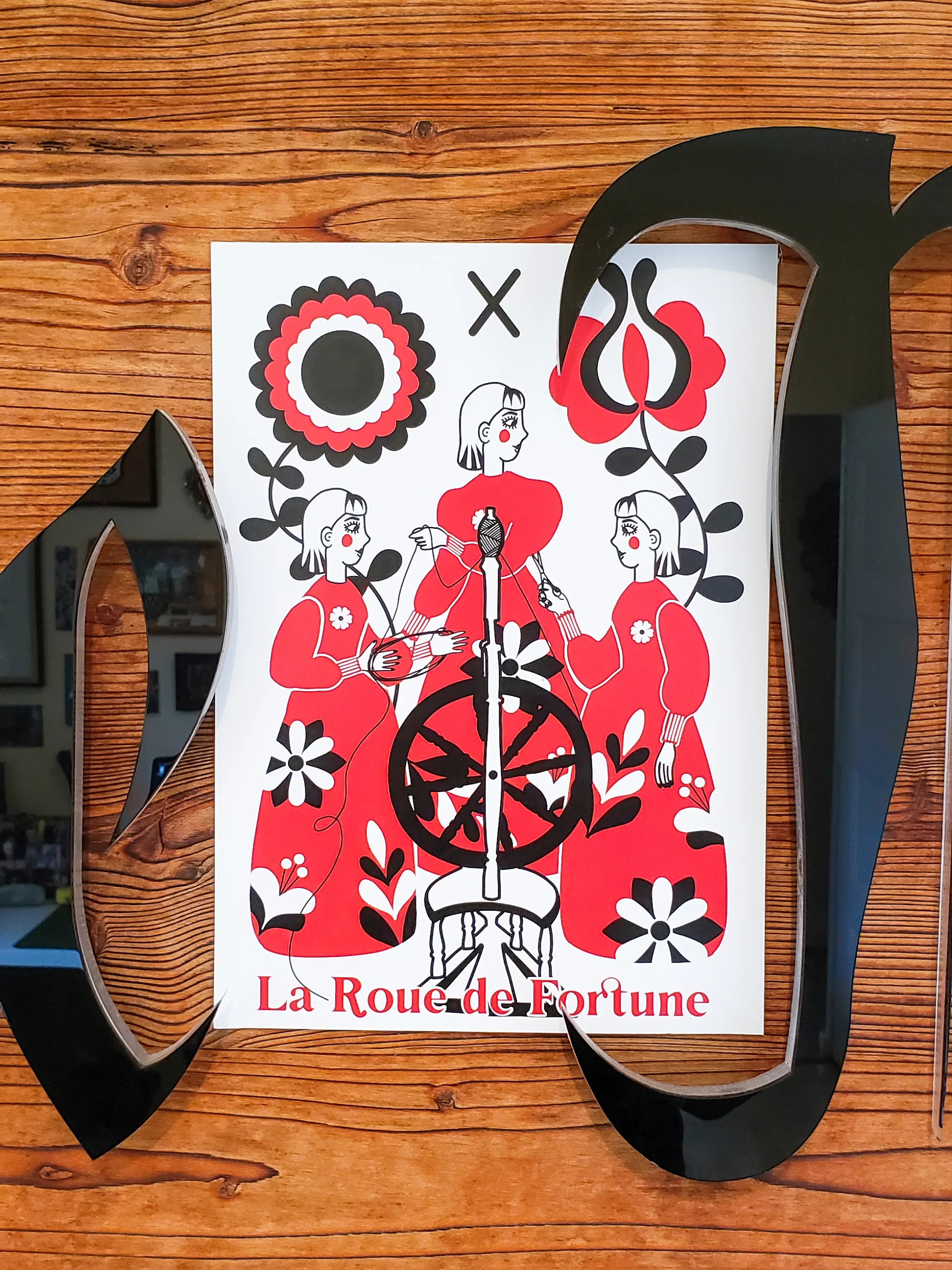 Affiche A4 du tarot La Roue de Fortune, illustration pop folk ésotérique en rouge, noir et blanc, représentant la roue symbolique du destin et des cycles de vie.